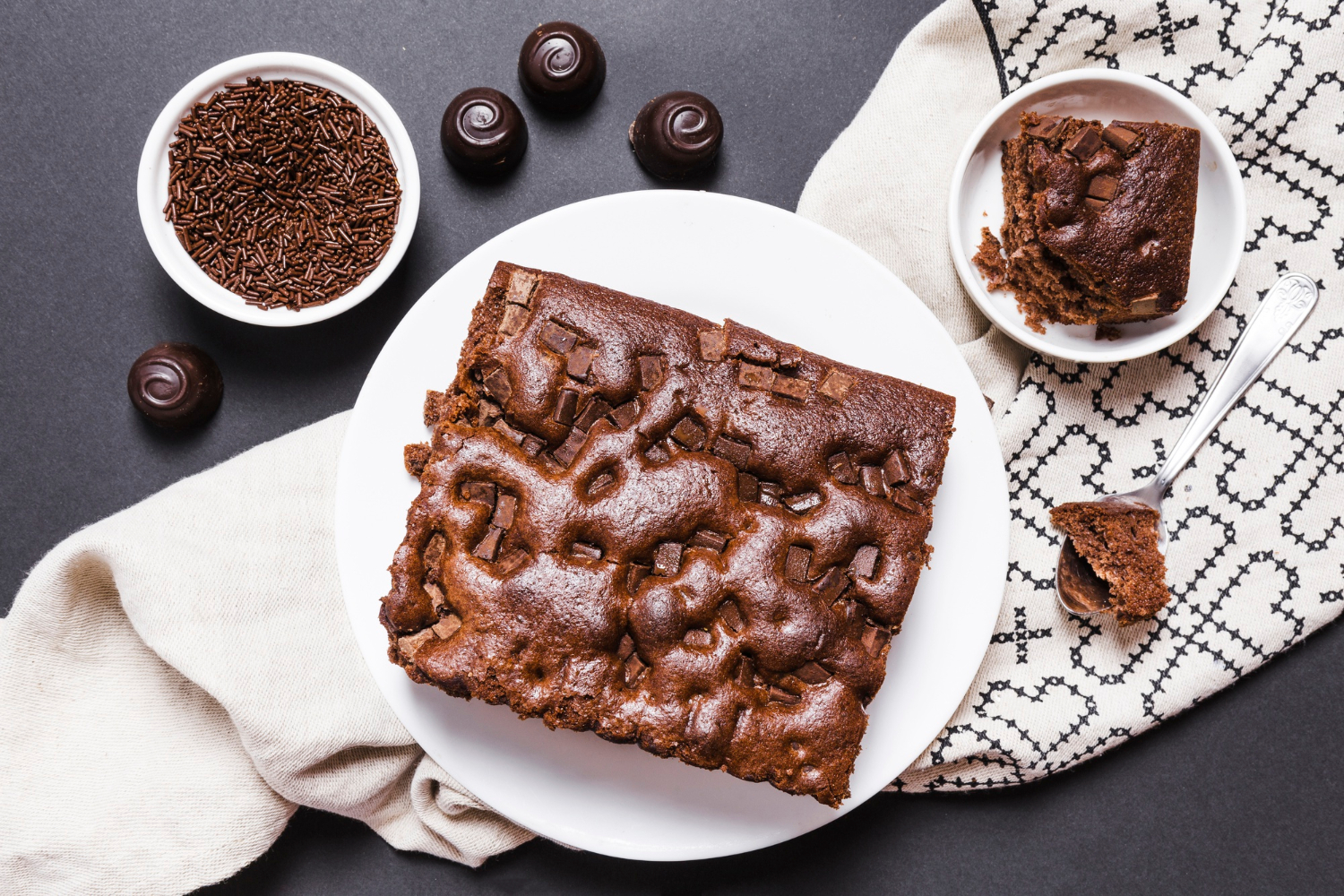 A delicious, rich Texas sheet cake topped with a glossy chocolate frosting and a sprinkle of chopped pecans.